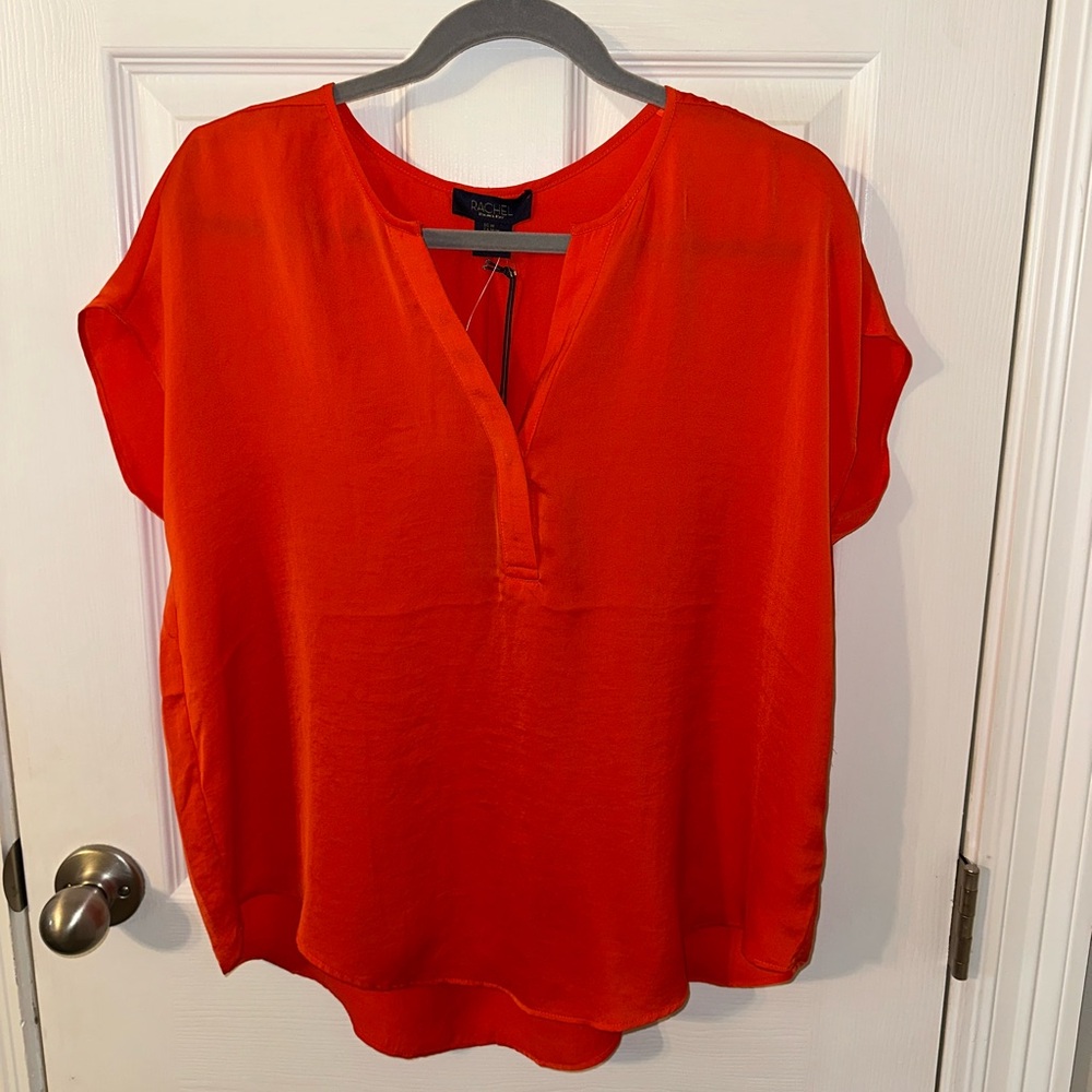 Rachel Roy beautiful orange flowy top. NWT. Size med.